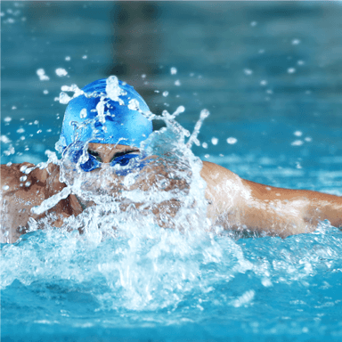 man swimming in swimming pool